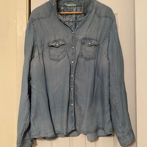 Blue denim button up shirt.